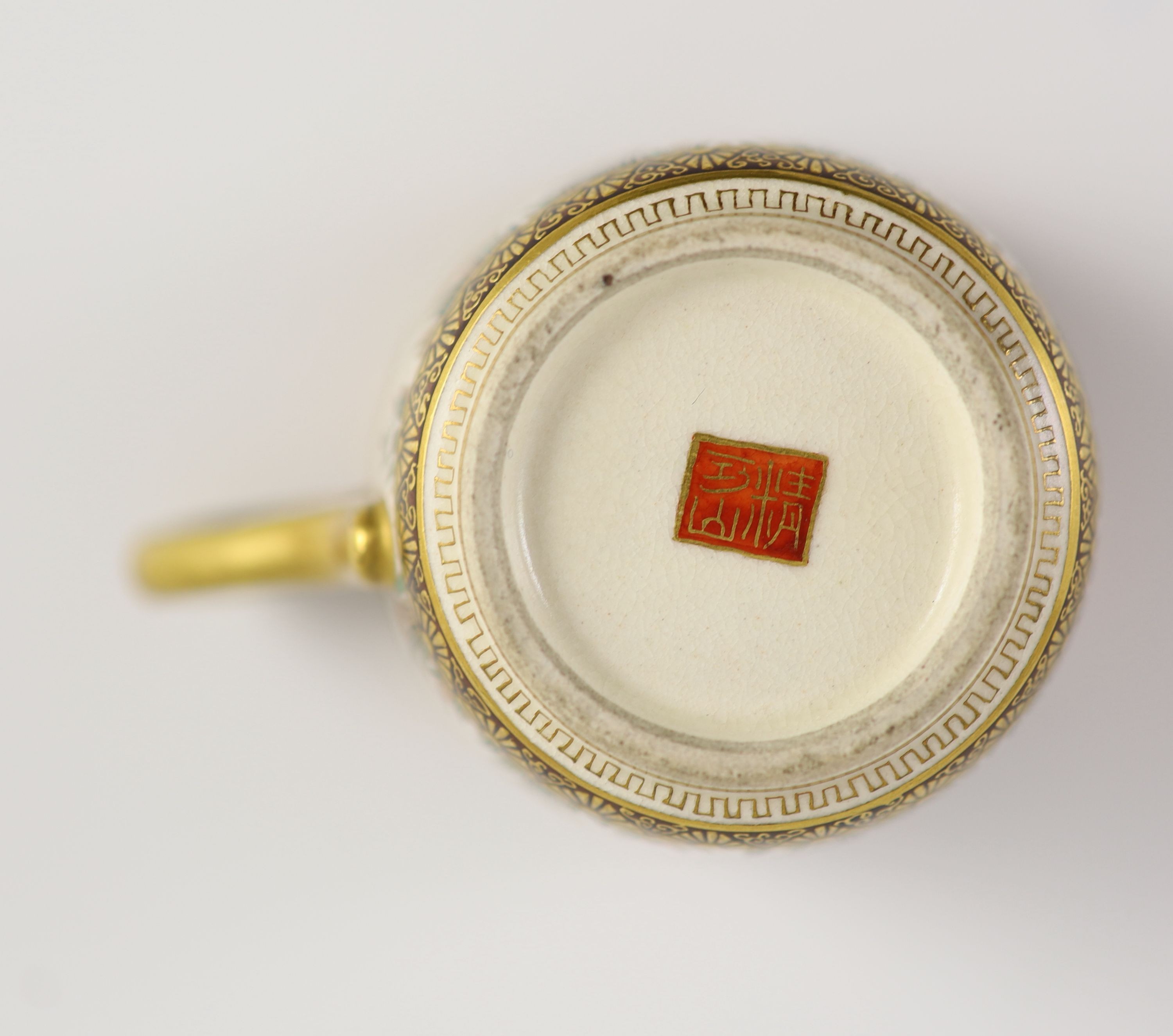 A Japanese Satsuma pottery cup and saucer, signed Seikozan, Meiji period, 11cm diameter